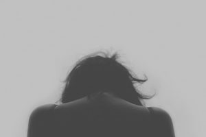 Woman grieving, monochrome