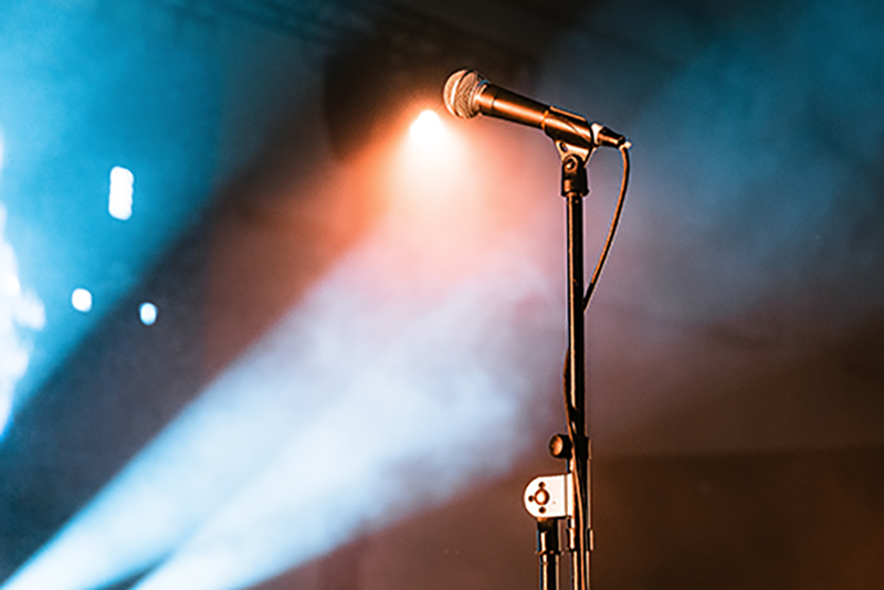 Microphone stand on a smoky stage