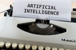 The words "artificial intelligence" types on an old-fashioned typewriter